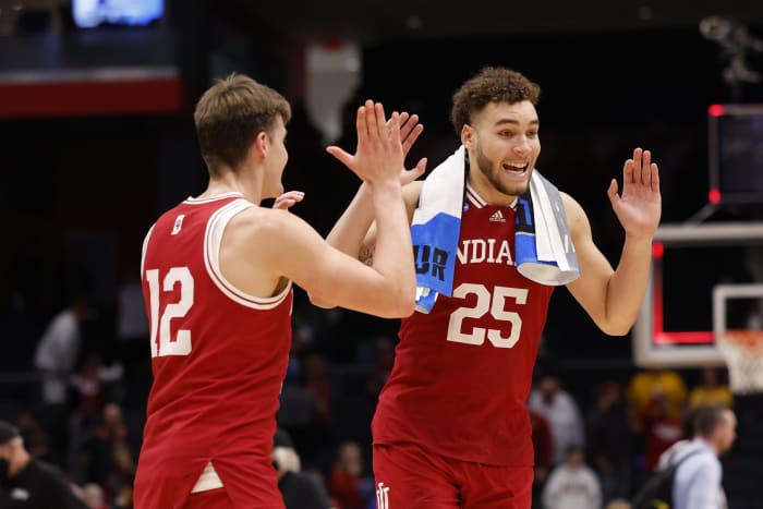Indiana Hoosiers forward Miller Kopp (12) celebrates with Indiana Hoosiers forward Race Thompson (25) after defeating Wyoming Cowboys during the First Four of the 2022 NCAA Tournament at UD Arena.